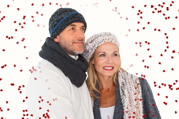 Happy couple in winter fashion embracing — Stock Photo, Image