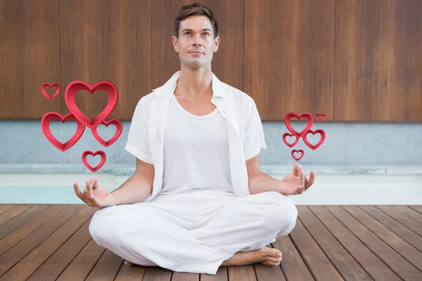 Handsome man in white meditating — Stock Photo, Image