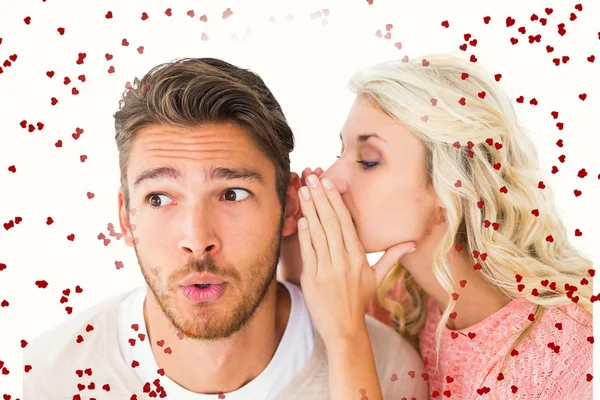 Attractive blonde whispering secret to boyfriend — Stock Photo, Image