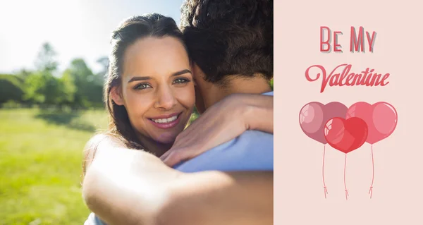 Loving and happy woman embracing man at park — Stock Photo, Image