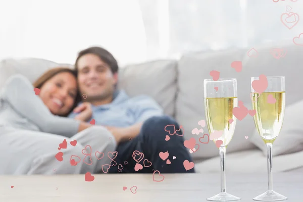 Couple resting on a couch — Stock Photo, Image