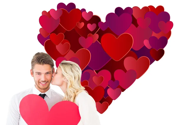 Attractive young couple holding red heart — Stock Photo, Image