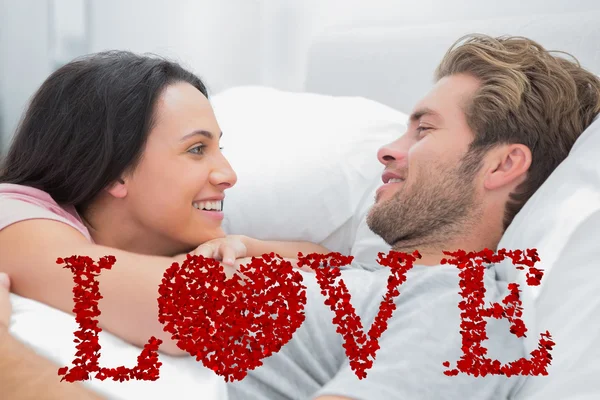 Cheerful couple awaking and looking — Stock Photo, Image