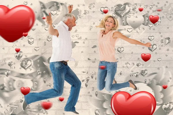 Excited couple cheering and jumping — Stock Photo, Image