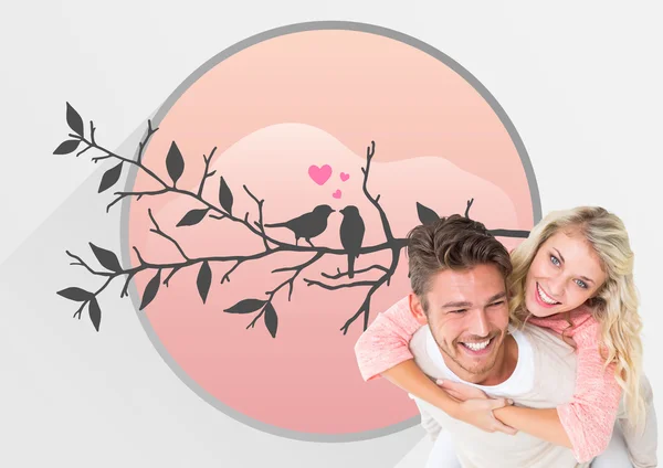 Handsome man giving piggy back to his girlfriend — Stock Photo, Image