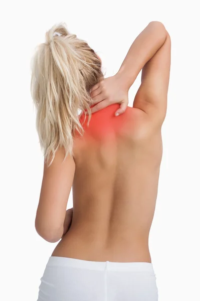 Rear view of topless woman with neck pain — Stock Photo, Image