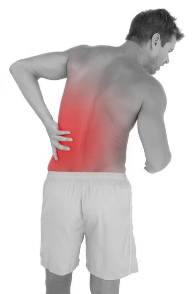 Hombre con pantalones cortos que sufren de dolor de espalda baja —  Fotos de Stock