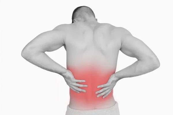 Rear view of shirtless man with back pain — Stock Photo, Image