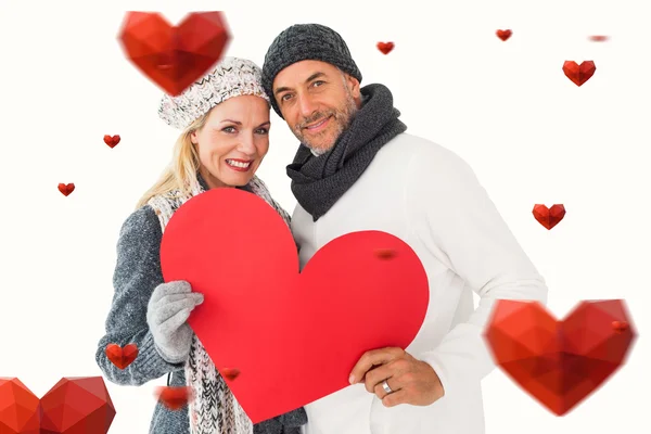 Smiling couple with heart shape — Stock Photo, Image