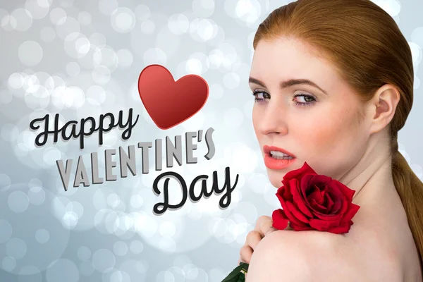 Beautiful redhead posing with red rose — Stock Photo, Image