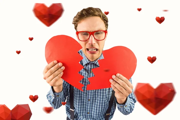 Geeky hipster holding broken heart — Stock Photo, Image