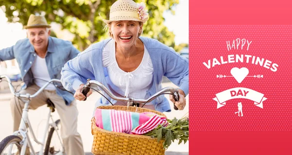 Happy mature couple going for a bike ride — Stock Photo, Image