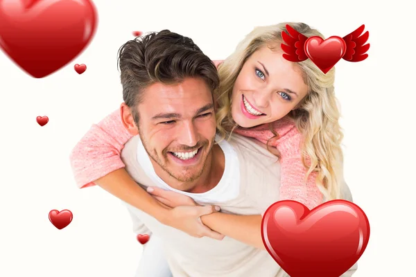 Man giving piggy back to girlfriend — Stock Photo, Image