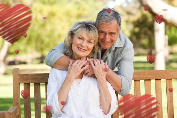 Elderly man hugging his wife — Stock Photo, Image