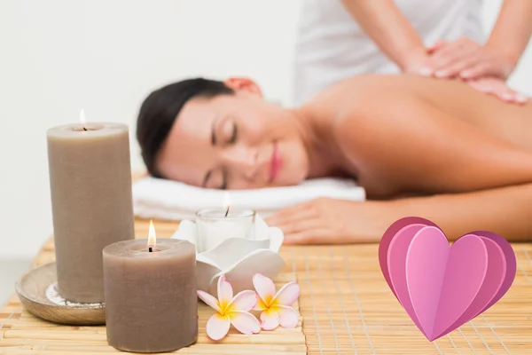 Beautiful brunette enjoying a back massage — Stock Photo, Image