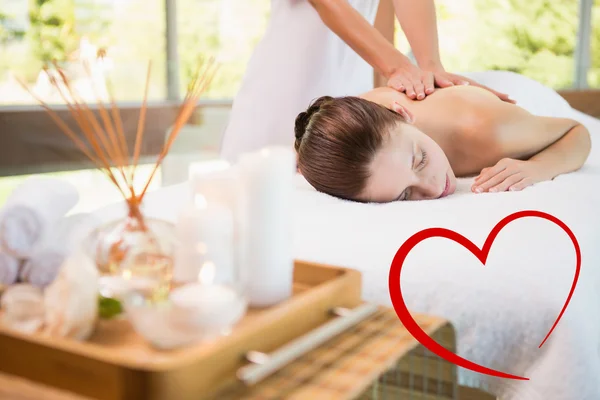 Attractive woman receiving back massage — Stock Photo, Image