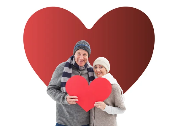 Happy mature couple in winter clothes holding — Stock Photo, Image