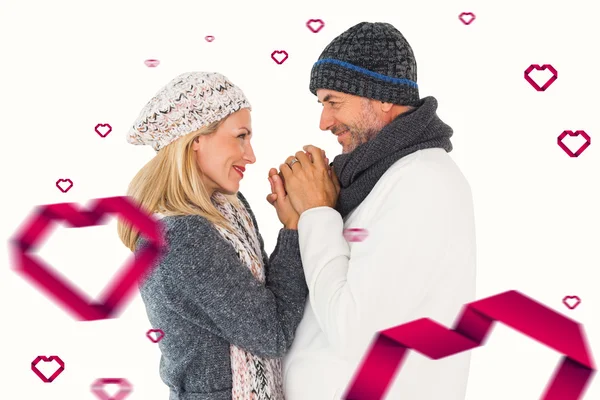 Couple in winter fashion embracing — Stock Photo, Image