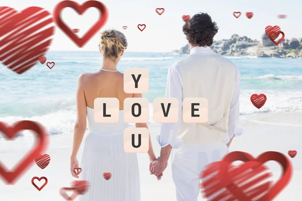 Bride and groom holding hands — Stock Photo, Image