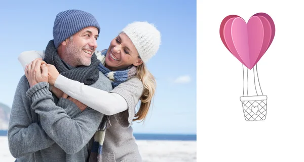 Attractive couple hugging on the beach in warm — Stock Photo, Image