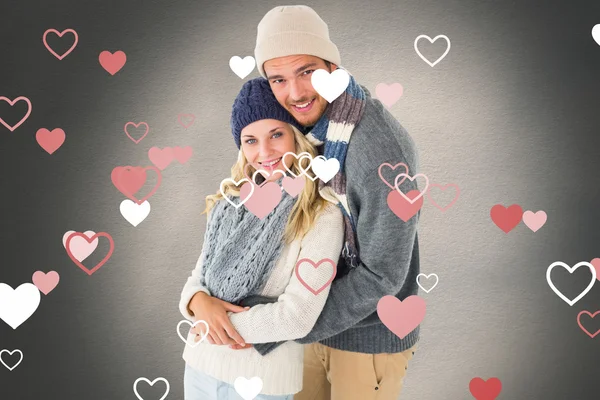 Couple in winter fashion hugging — Stock Photo, Image