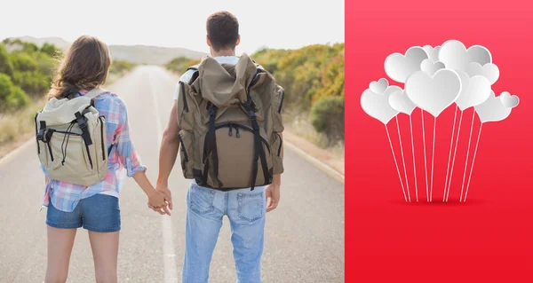 Hiking couple standing on countryside road — Stock Photo, Image