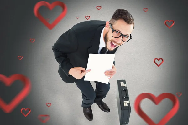 Geeky smiling businessman showing paper — Stock Photo, Image