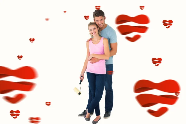 Young couple painting with roller — Stock Photo, Image