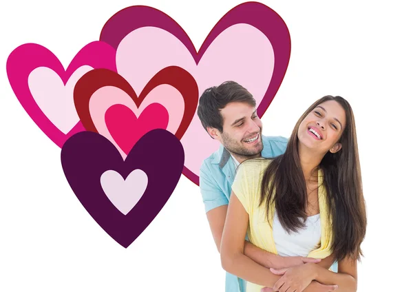 Casual couple smiling and hugging — Stock Photo, Image