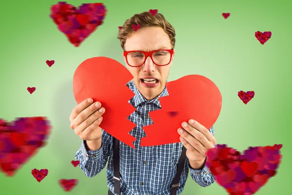 Geeky hipster kırık kalp tutan — Stok fotoğraf