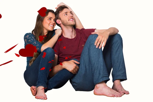 Giovane coppia seduta sul pavimento — Foto Stock