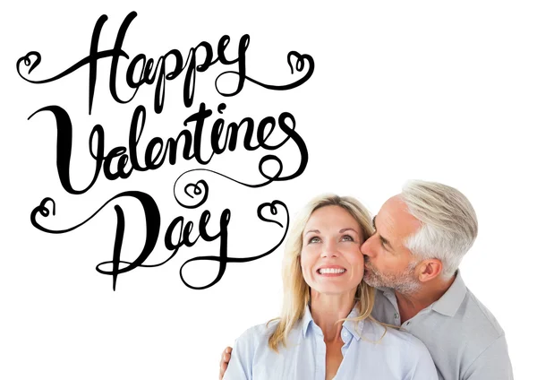 Affectionate man kissing wife on cheek — Stock Photo, Image