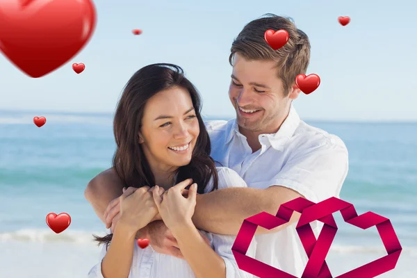 Cheerful couple relaxing on the beach during — Stock Photo, Image