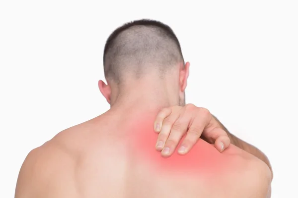 Rear view of shirtless man with neck pain — Stock Photo, Image