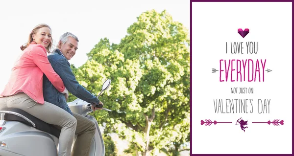 Happy senior couple riding a moped — Stock Photo, Image