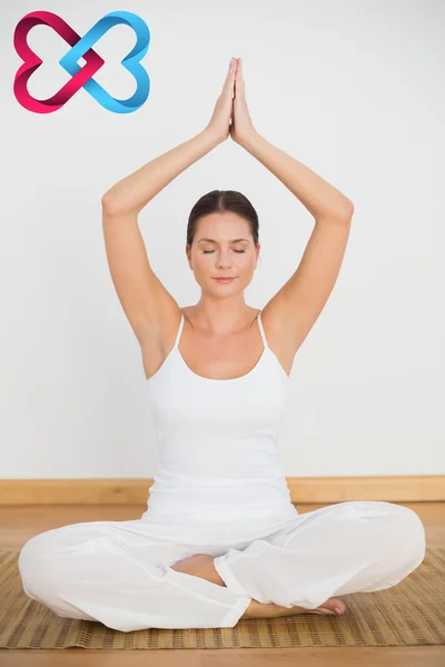 Peaceful brunette sitting and meditating — Stock Photo, Image