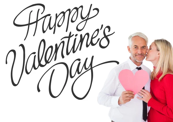 Handsome man holding paper heart — Stock Photo, Image