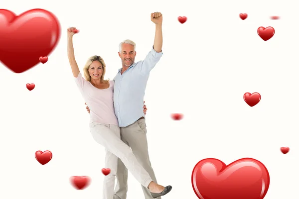 Smiling couple cheering — Stock Photo, Image