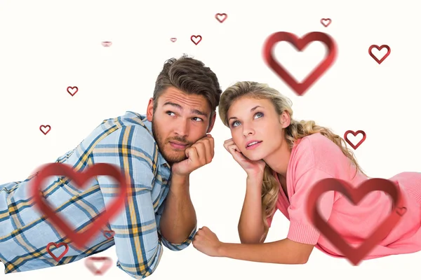 Attractive couple lying and thinking — Stock Photo, Image