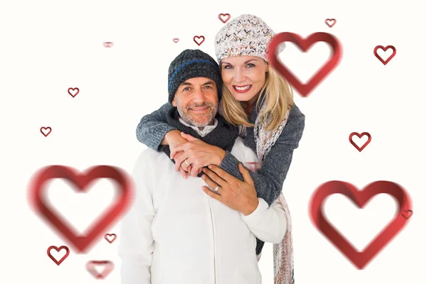 Couple in winter fashion embracing — Stock Photo, Image