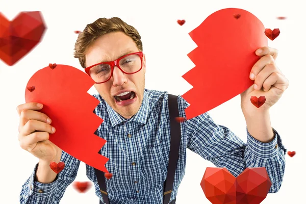 Geeky hipster holding broken heart — Stock Photo, Image