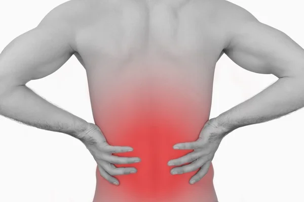 Rear view of muscular man with backache — Stock Photo, Image