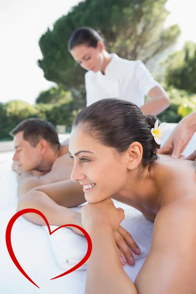 Attractive couple enjoying couples massage — Stock Photo, Image
