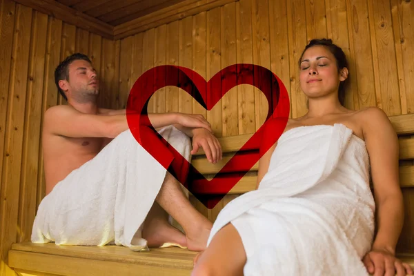 Happy couple relaxing in a sauna — Stock Photo, Image