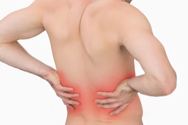 Rear view of muscular man with backache — Stock Photo, Image