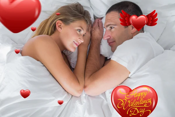 Couple lying and looking at each other — Stock Photo, Image