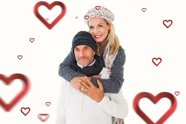 Couple in winter fashion embracing — Stock Photo, Image