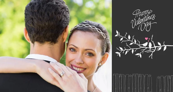 Portrait of happy bride embracing groom — Stock Photo, Image