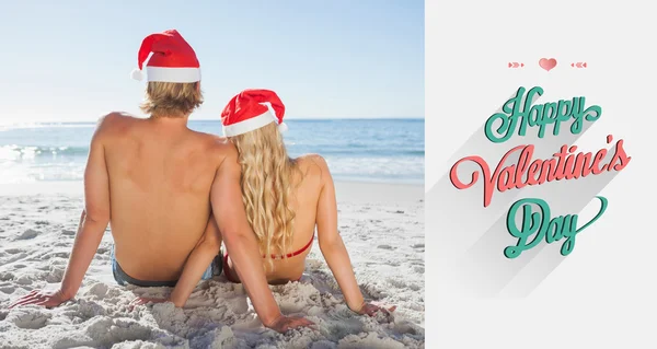 Rear view of couple sitting on beach — Stock Photo, Image
