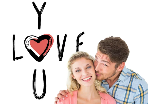 Handsome man kissing girlfriend on cheek — Stock Photo, Image